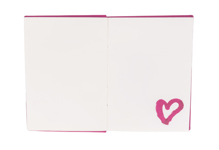 Open blank book with lipstick heart paint isolated on white backgroundの写真素材
