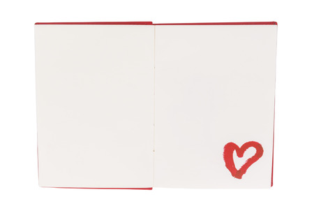 Open blank book with lipstick heart paint isolated on white backgroundの写真素材