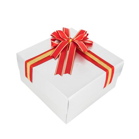 Silver gift box and red ribbon isolated on white backgroundの写真素材