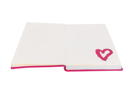 Open blank book with lipstick heart paint isolated on white backgroundの写真素材