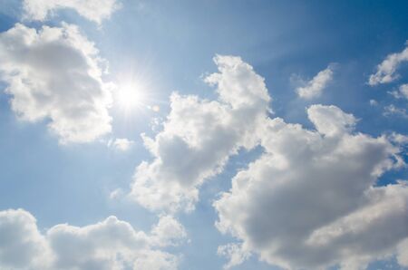 Sunshine on blue sky with white cloudの写真素材