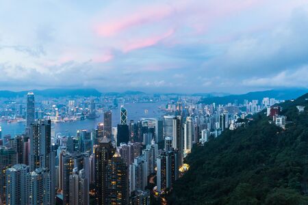 Hong kong china cityscape in the evening from victoria peakの写真素材