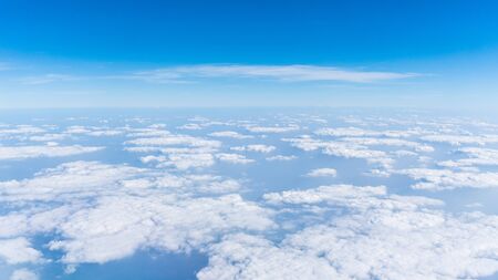 Cloud and blue sky view from airplaneの写真素材