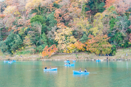 Kyoto, Japan - Nov 25, 2017: Arashiyama and Katsura river is the famous destination for tourist in autumn of japan. Many tourists sightseeing and sailing in the riverのeditorial素材