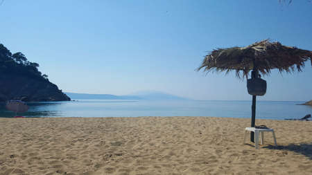 Beautiful Micros Aselinos beach on Skiathos island in Greece, umbrella, summer day in Juneの写真素材