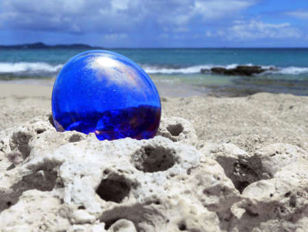 Blue Shiny Stone on Seascape Background の写真素材