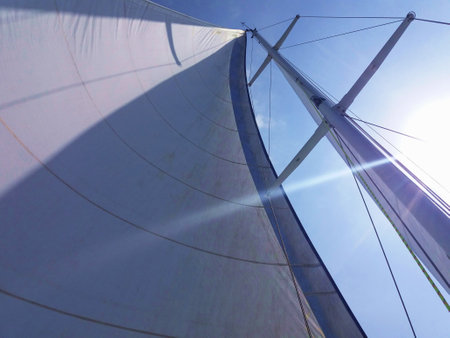Detail of the mast of a sailing yacht with a clear blue skyの写真素材