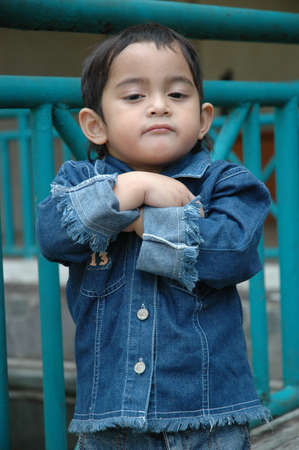 little boy with cool faceの写真素材