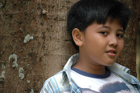 young boy with cute face の写真素材