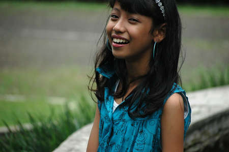 little girl with nice smile expressionの写真素材