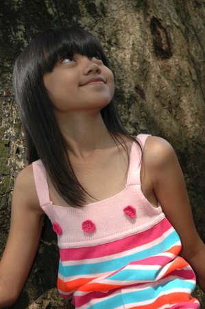 little girl looking for somethingの写真素材