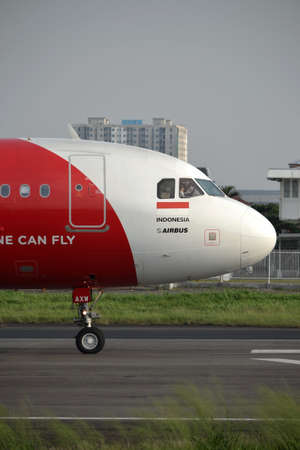 bandung, indonesia-june 16, 2014  Air Asia airplane taking manoeuvre on husein sastranegara airport...