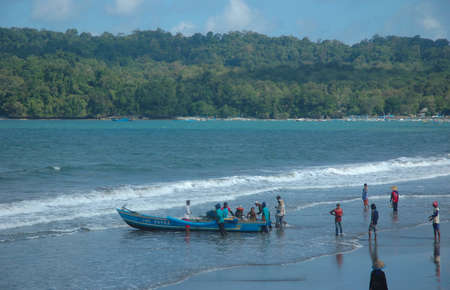 pangandaran, indonesia-july 16, 2011  fisherman at pangandaran beach, west java-indonesia のeditorial素材