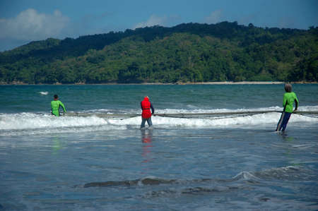 pangandaran, indonesia-july 16, 2011  fisherman at pangandaran beach, west java-indonesia のeditorial素材