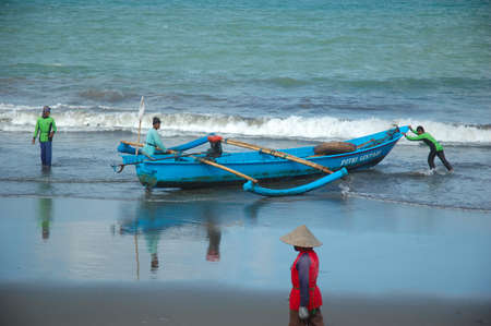 pangandaran, indonesia-july 16, 2011  fisherman at pangandaran beach, west java-indonesia のeditorial素材