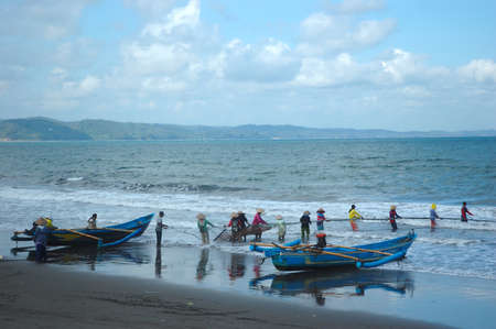pangandaran, indonesia-july 16, 2011  fisherman at pangandaran beach, west java-indonesia のeditorial素材