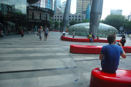 Orchard road, Singapore - April 14, 2013: Crowd shopping at Ion Orchard Mall in Singapore.のeditorial素材