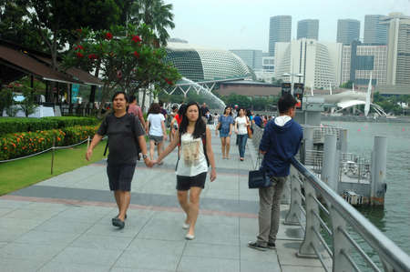 Singapore, Singapore - April 14, 2013: People crowd at One Fullerton, Singapore.のeditorial素材