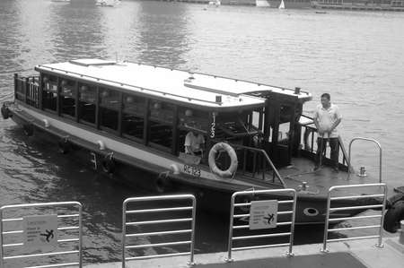 Singapore, Singapore - April 14, 2013: Tourist boat at Merlion Park harbour Singapore.のeditorial素材