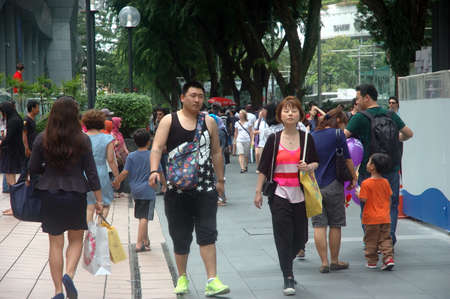 Singapore, Singapore - January 18, 2014: People crowd at Orchard road Singapore.のeditorial素材