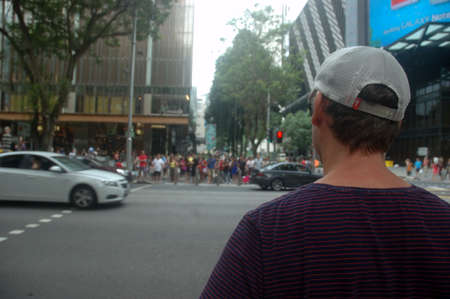 Singapore, Singapore - January 18, 2014: People crowd at Orchard road Singapore.のeditorial素材