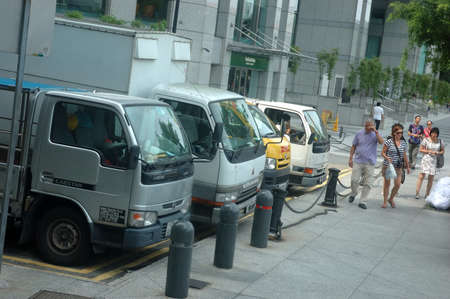 Singapore, Singapore - January 18, 2014: Trucks parked at Clarke Quay riverside, Singapore.のeditorial素材