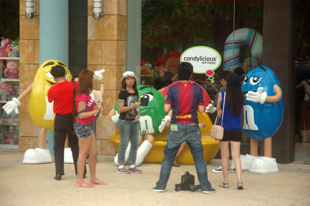 Sentosa island, Singapore - January 18, 2014: People crowd at Universal Studio Singapore.のeditorial素材
