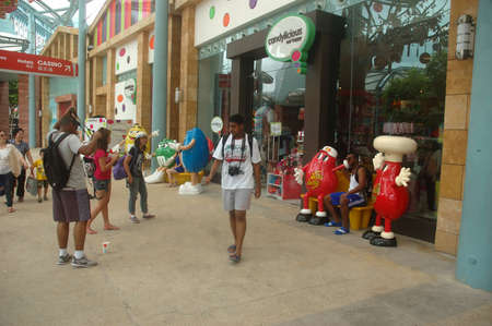 Sentosa island, Singapore - January 18, 2014: People crowd at Universal Studio Singapore.のeditorial素材