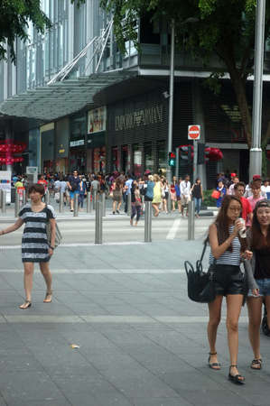 Singapore, Singapore - January 18, 2014: People crowd at Orchard road Singapore.のeditorial素材