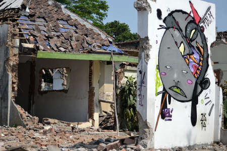 Bandung, Indonesia - September 17, 2014: Wall graffiti that painted on house ruin.