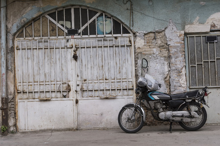 Downtown Area, Ancient Building Architecture and A Motorcycle in Urban Area , Tehranの写真素材