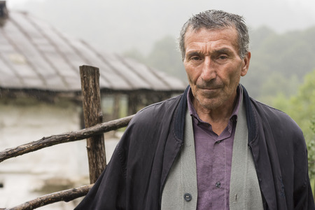 Lasak, IRAN - July 29, 2016, Portrait of an Elderly Man in Rainy Day. Gilan Province.のeditorial素材