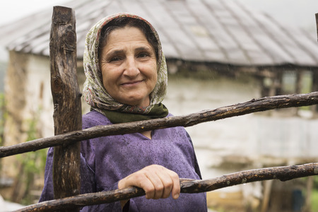 Lasak, IRAN - July 29, 2016, Portrait of an Elderly Woman in Rainy Day. Gilan Provinceのeditorial素材