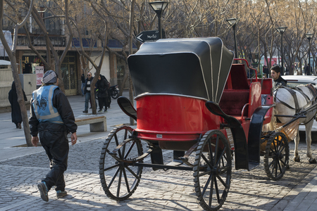 Tehran, IRAN - January 6, 2017 Back View of Traditional Old-fashioned Fiacre, Horse-driven Carriage Through The Tehran Down Town Street.のeditorial素材