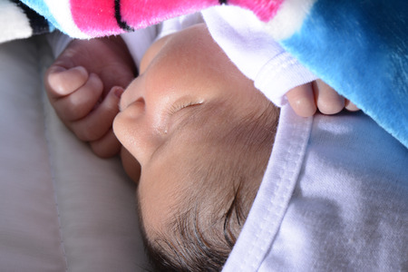 Newborn baby peacefully sleepingの写真素材