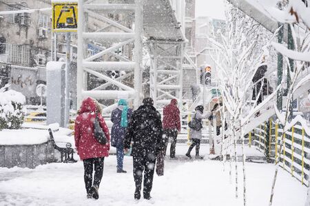 Dr Fatemi street Tehran, IRAN - January 28, 2018 People going up to overpass bridge to moving other side of street in snowy day.のeditorial素材