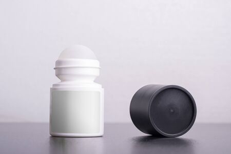 Roll on antiperspirant deodorant in front of white background, editable mock up template with smart...