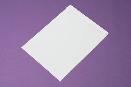 An A4 paper envelope on purple backdrop, editable mock up template for your design, selection path...