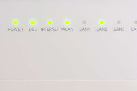 Modern white wireless internet router/modem led lights
