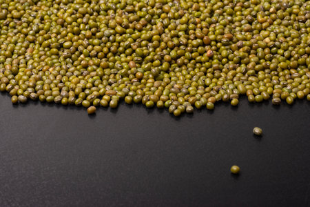 Mung beans on a black background, top viewpointの写真素材