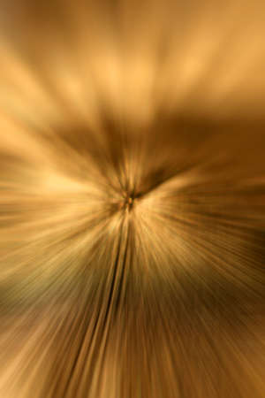 Gold radial zoom effected abstract backgroundの写真素材