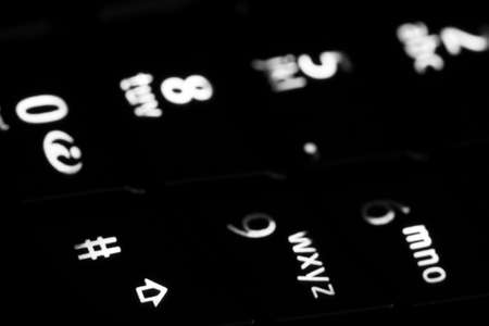 Macro of mobile phone in the darkの写真素材