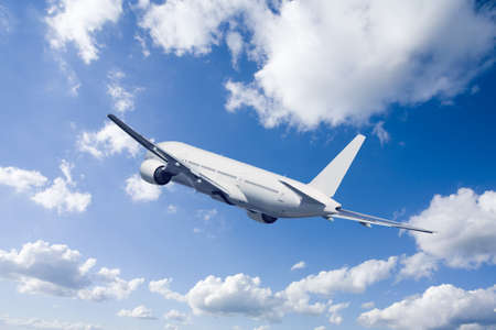 An airplane flying in the blue sky