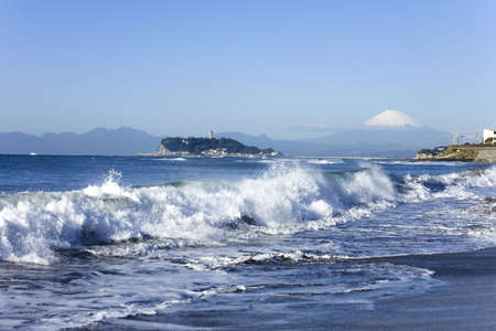 Beach and waves, Mt Fuji and Enoshima Island.の写真素材
