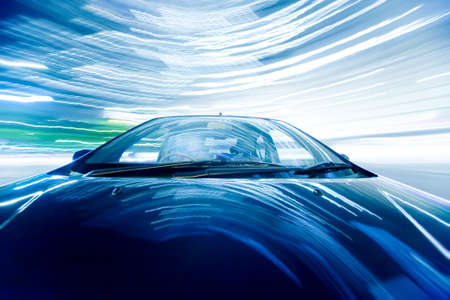 The car moves at great speed at the night.の写真素材