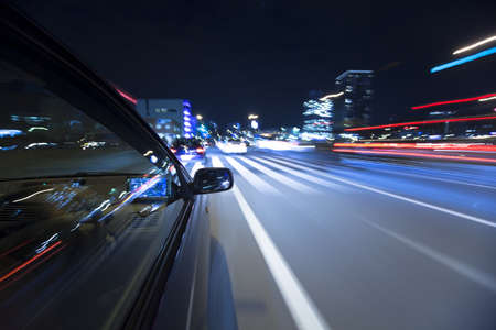 The car moves at great speed at the nightの写真素材