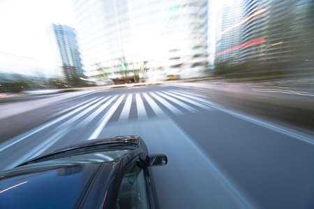 The car moves at great speed at the eveningの写真素材