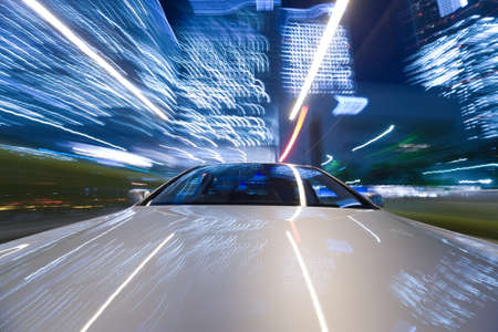 The car moves at great speed at the night.の写真素材