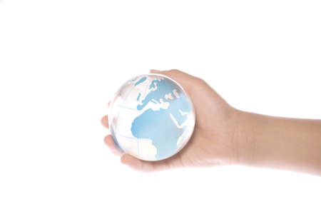 Child holding a globe in handsの写真素材