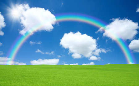 Green field and rainbowの写真素材